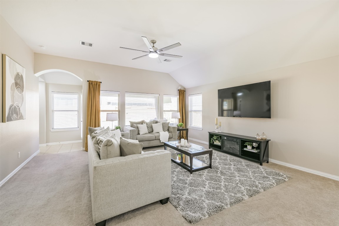 9622 Invergarry Way Tomball, TX 77375 - Photo 4 of 32 a living room with furniture and a flat screen tv