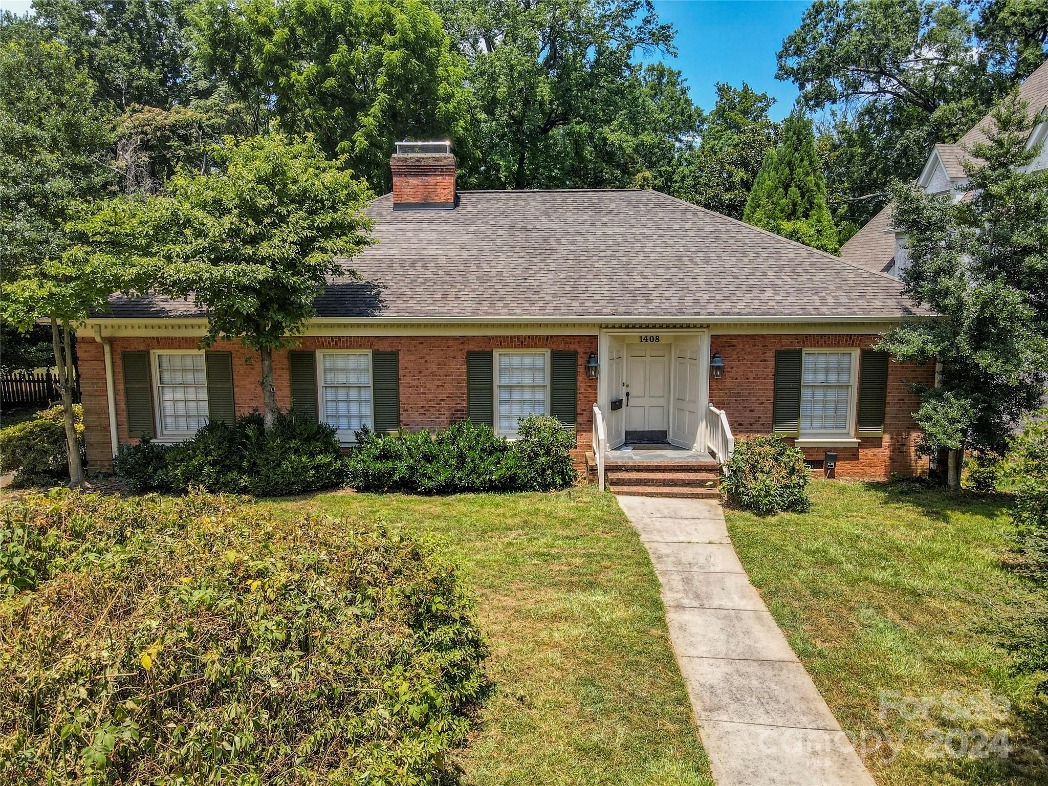 a view of a house with garden and yard