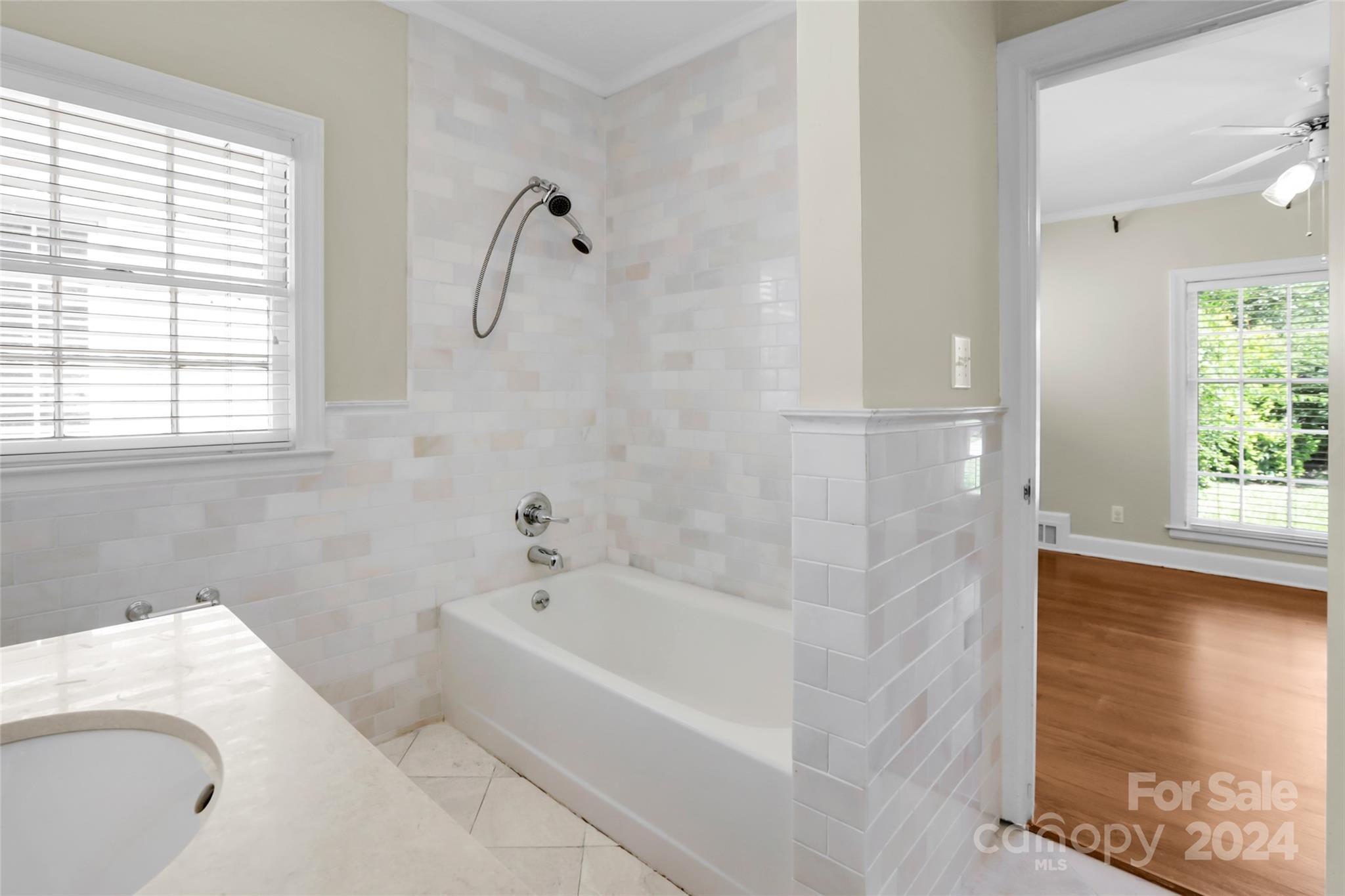 1408 Sterling Road Charlotte, NC 28209 - Photo 16 of 28 a bathroom with a bathtub and a shower
