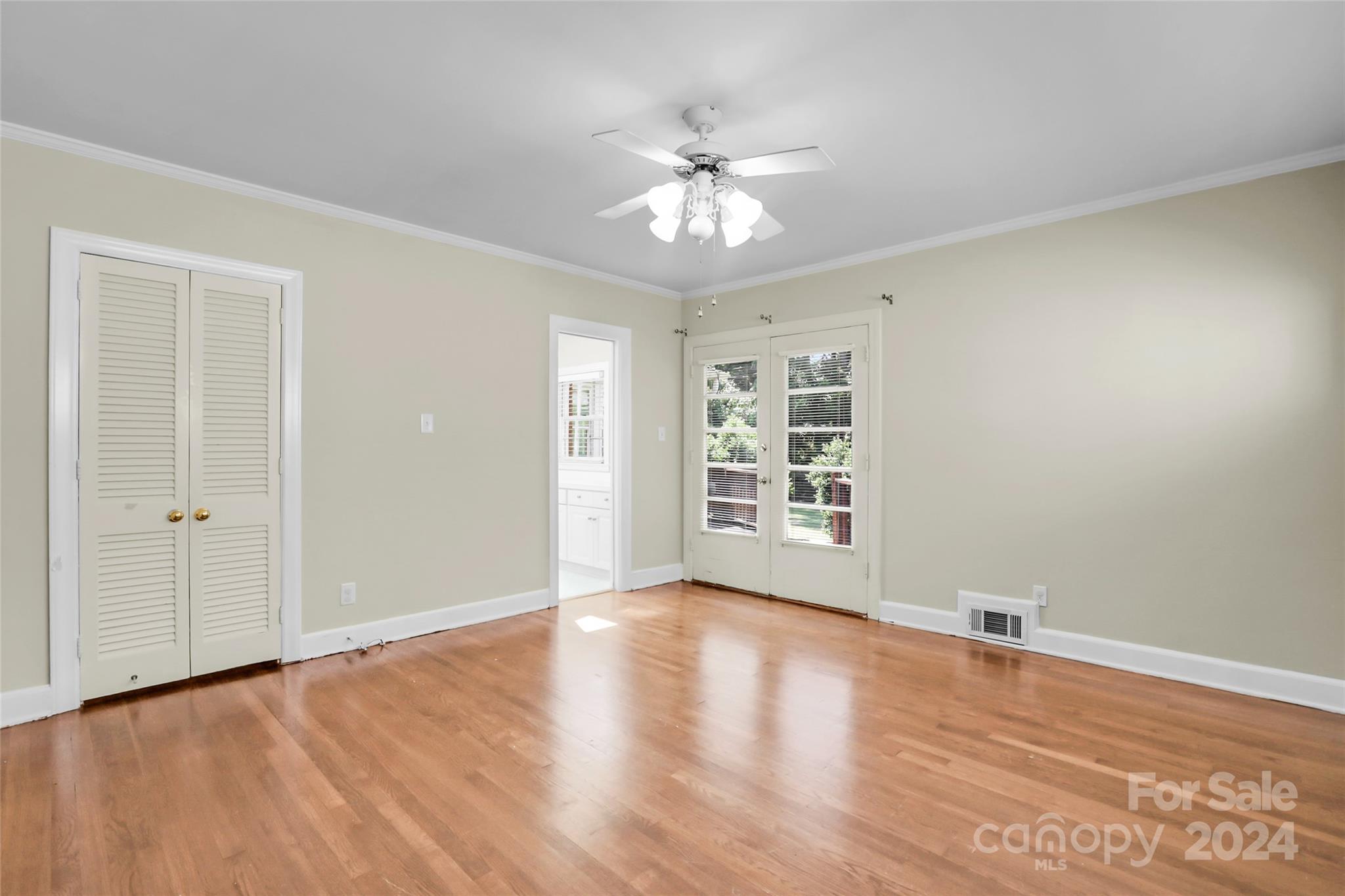 1408 Sterling Road Charlotte, NC 28209 - Photo 17 of 28 a view of an empty room with wooden floor and a window