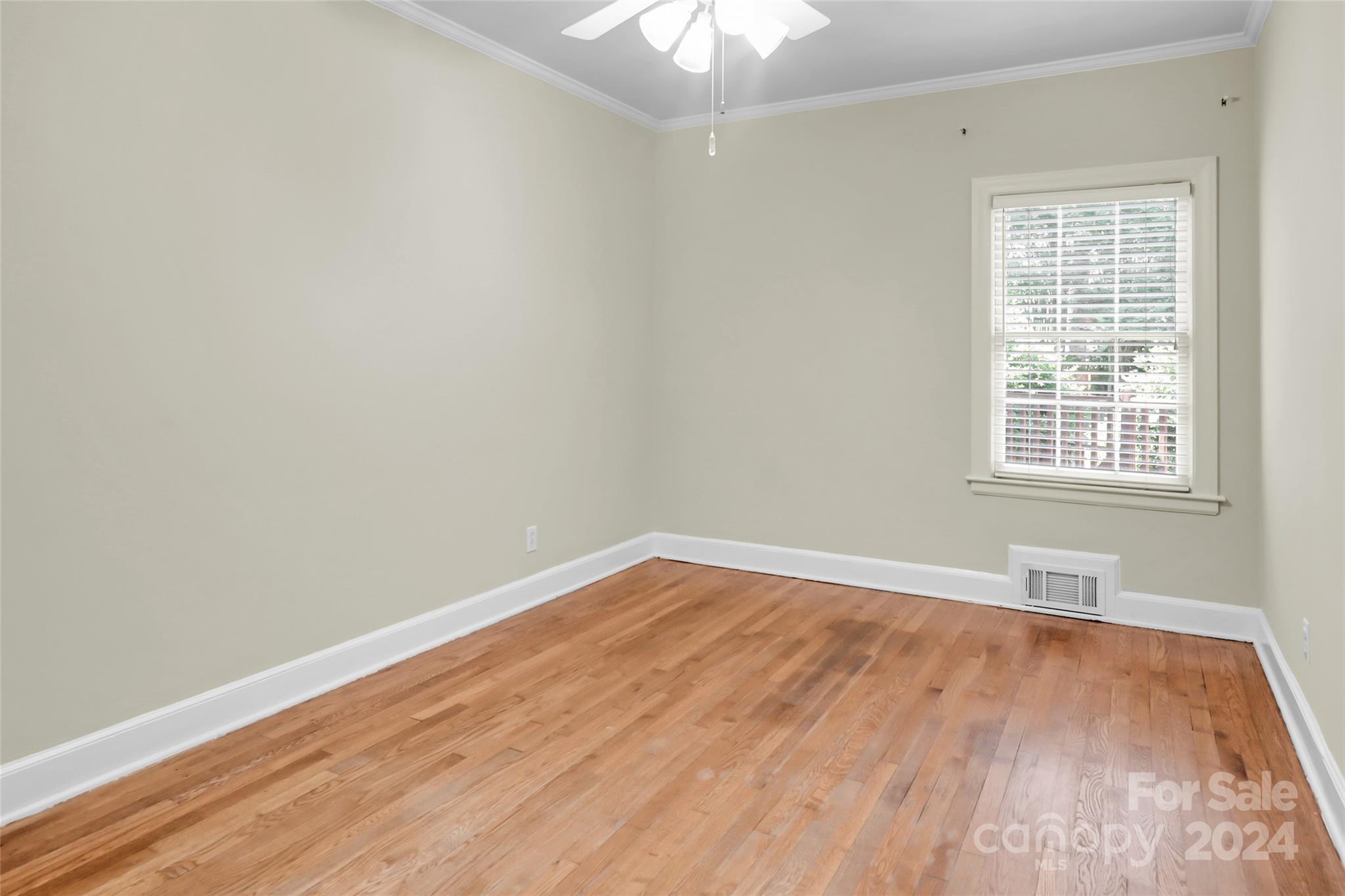 1408 Sterling Road Charlotte, NC 28209 - Photo 21 of 28 an empty room with wooden floor and windows