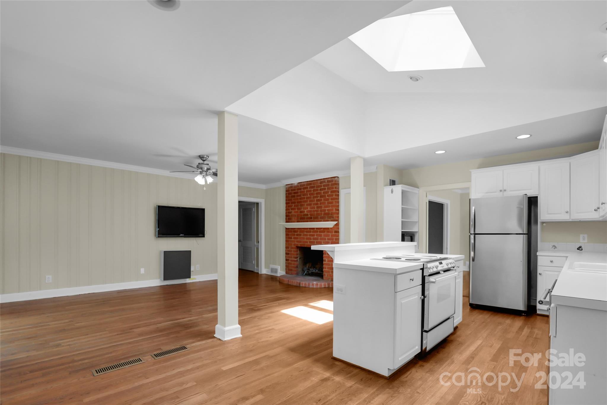 1408 Sterling Road Charlotte, NC 28209 - Photo 3 of 28 a view of kitchen with stainless steel appliances kitchen island sink stove and refrigerator