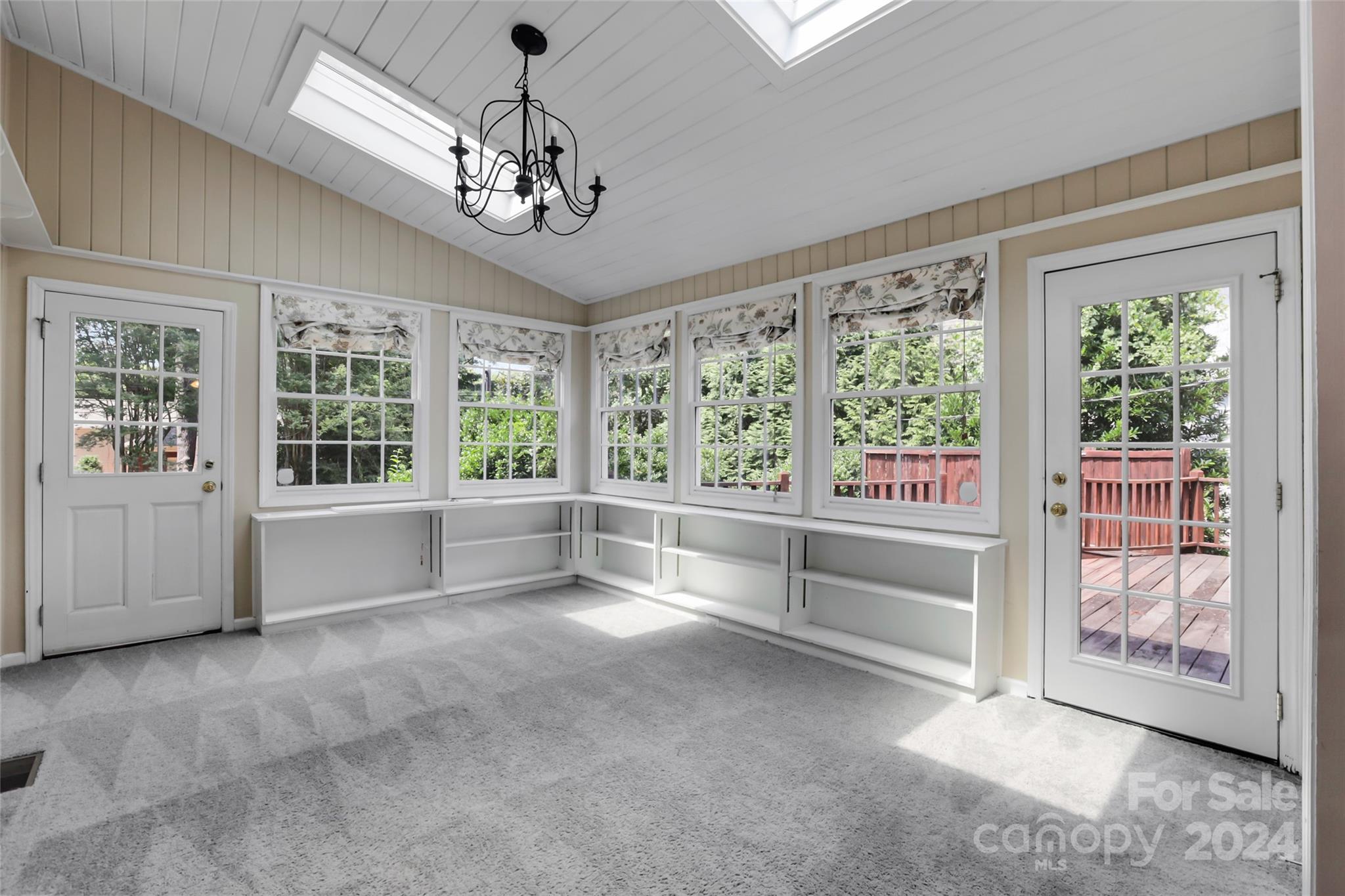 1408 Sterling Road Charlotte, NC 28209 - Photo 6 of 28 wooden floor in an empty room with a window