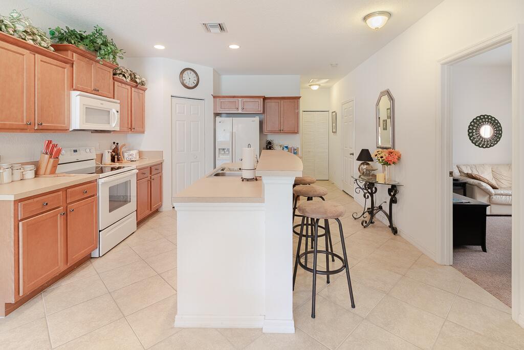9704 Windrift Circle Fort Pierce, FL 34945 - Photo 6 of 19 Kitchen and Bar