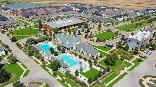 an aerial view of residential houses with outdoor space