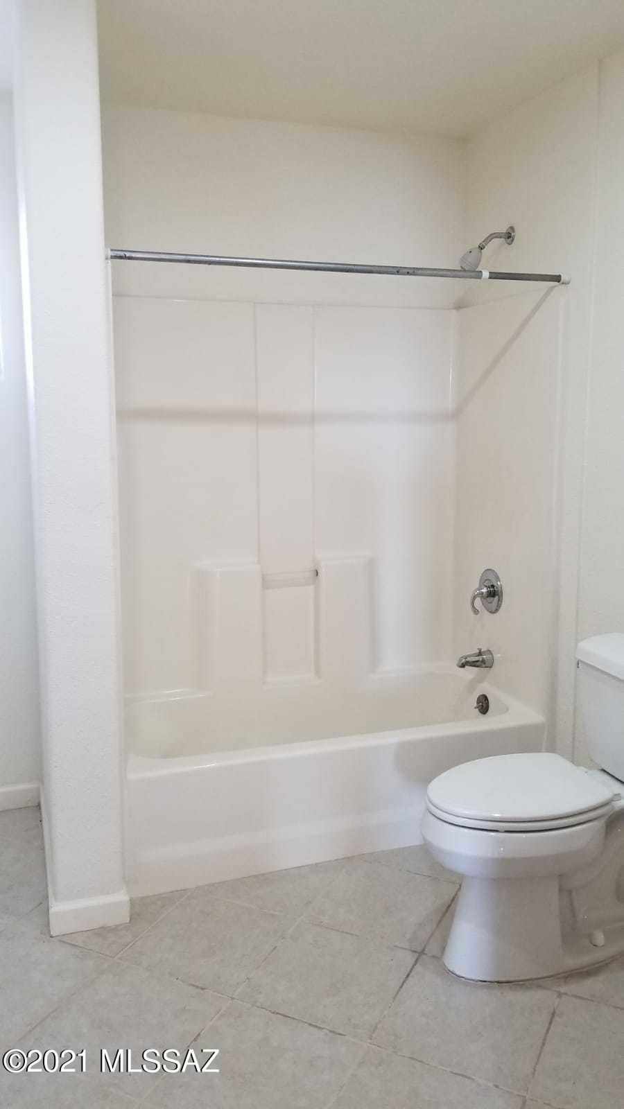 897 Via Savalza Rio Rico, AZ 85648 - Photo 24 of 27 a bathroom with a toilet and a shower