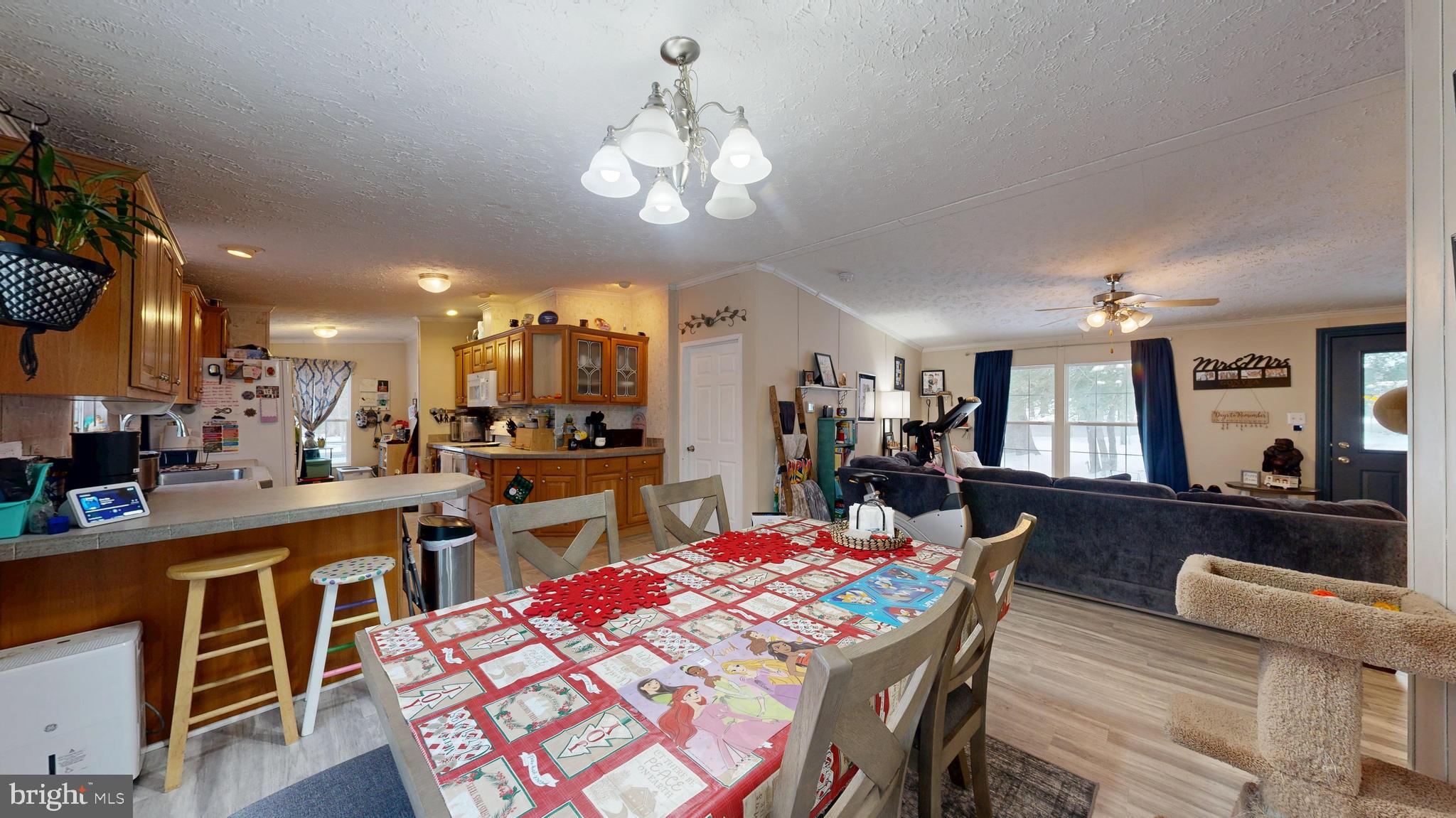 22901 Camp Arrowhead Road Lewes, DE 19958 - Photo 21 of 39 a large kitchen with a table and chairs