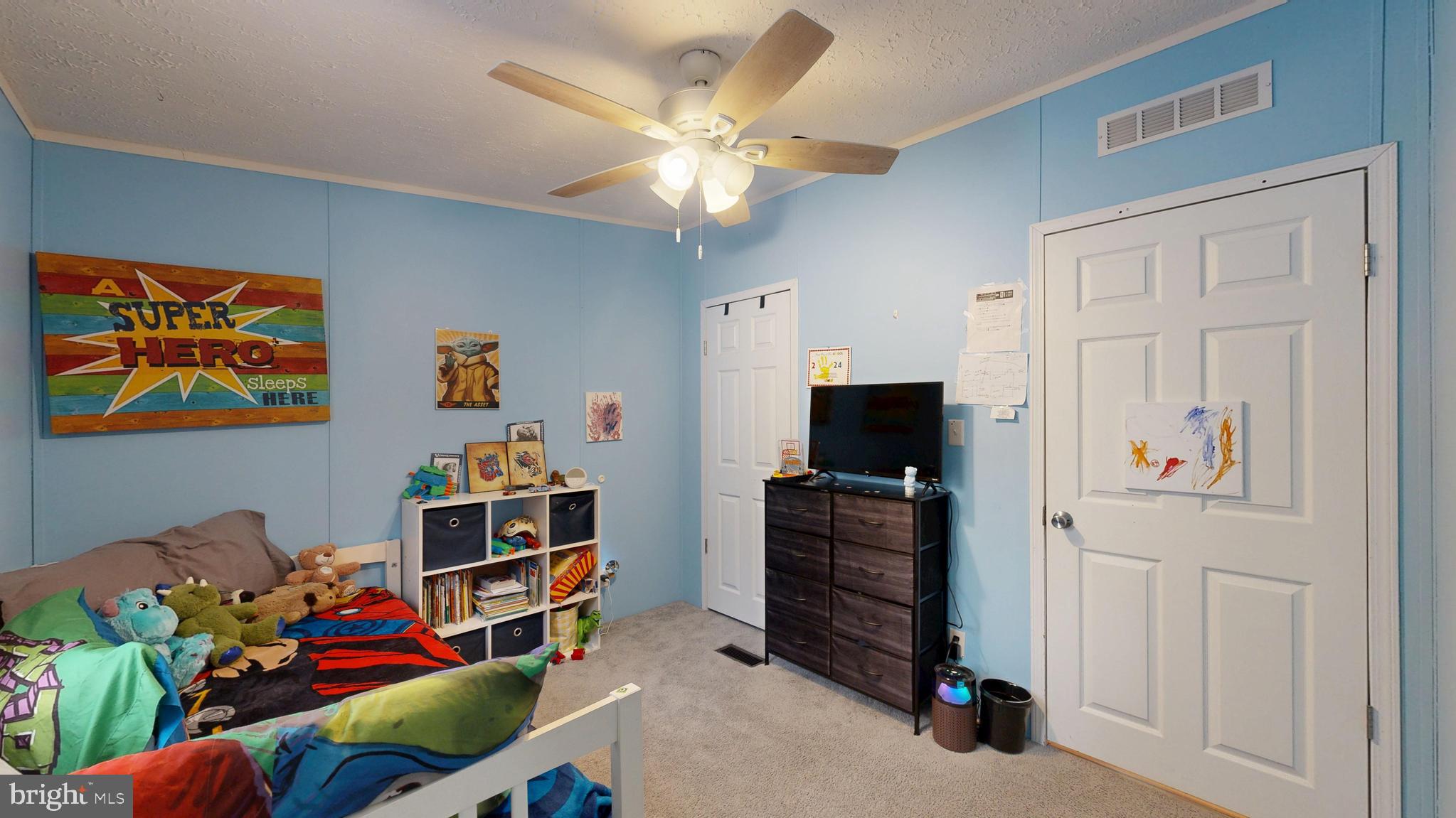 22901 Camp Arrowhead Road Lewes, DE 19958 - Photo 24 of 39 workspace with wooden floor stairs and a chandelier fan
