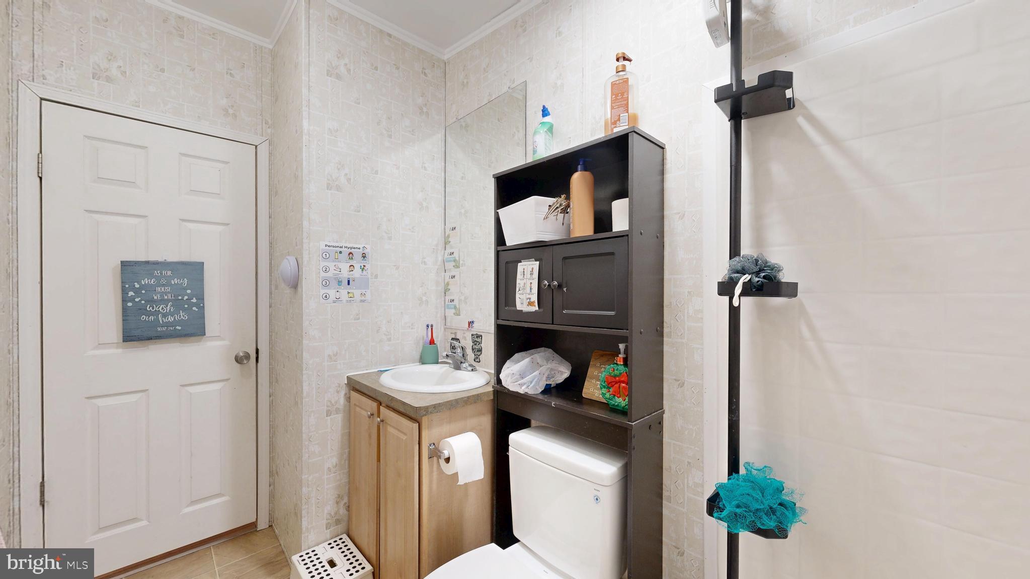 22901 Camp Arrowhead Road Lewes, DE 19958 - Photo 30 of 39 a utility room with dryer and washer