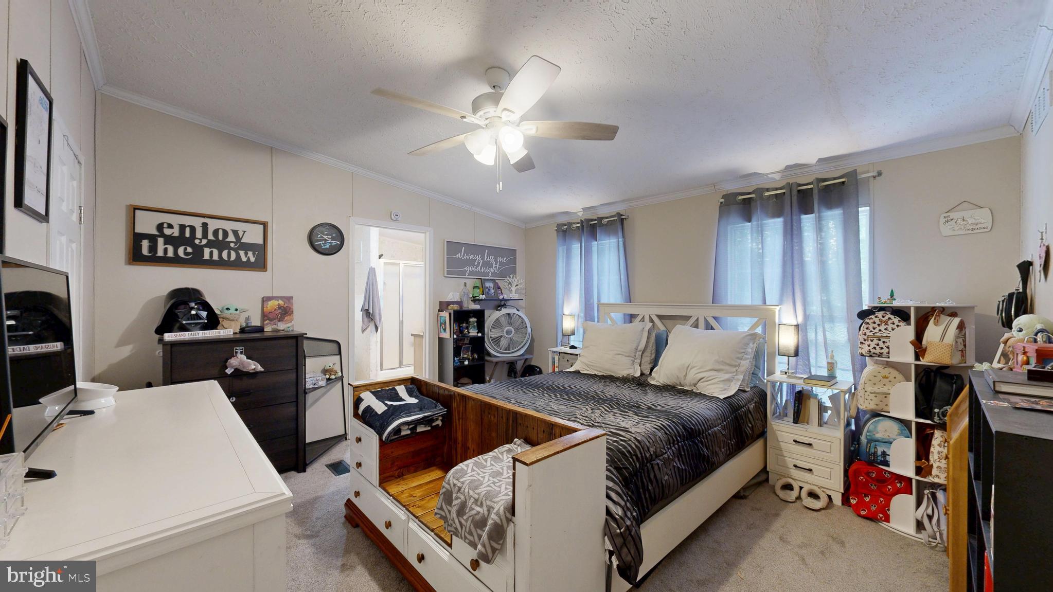 22901 Camp Arrowhead Road Lewes, DE 19958 - Photo 33 of 39 a living room with furniture and a flat screen tv