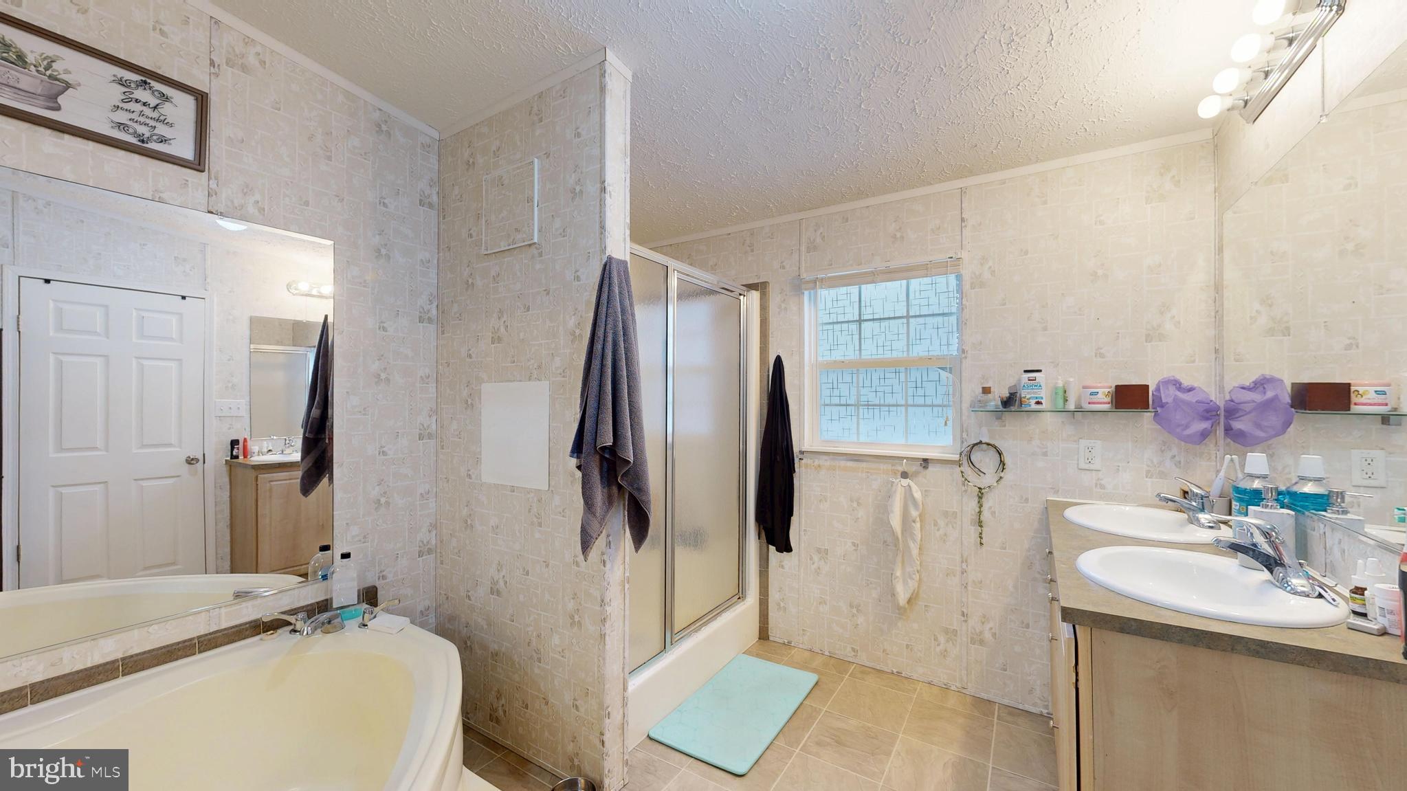 22901 Camp Arrowhead Road Lewes, DE 19958 - Photo 35 of 39 a bathroom with a sink toilet and shower