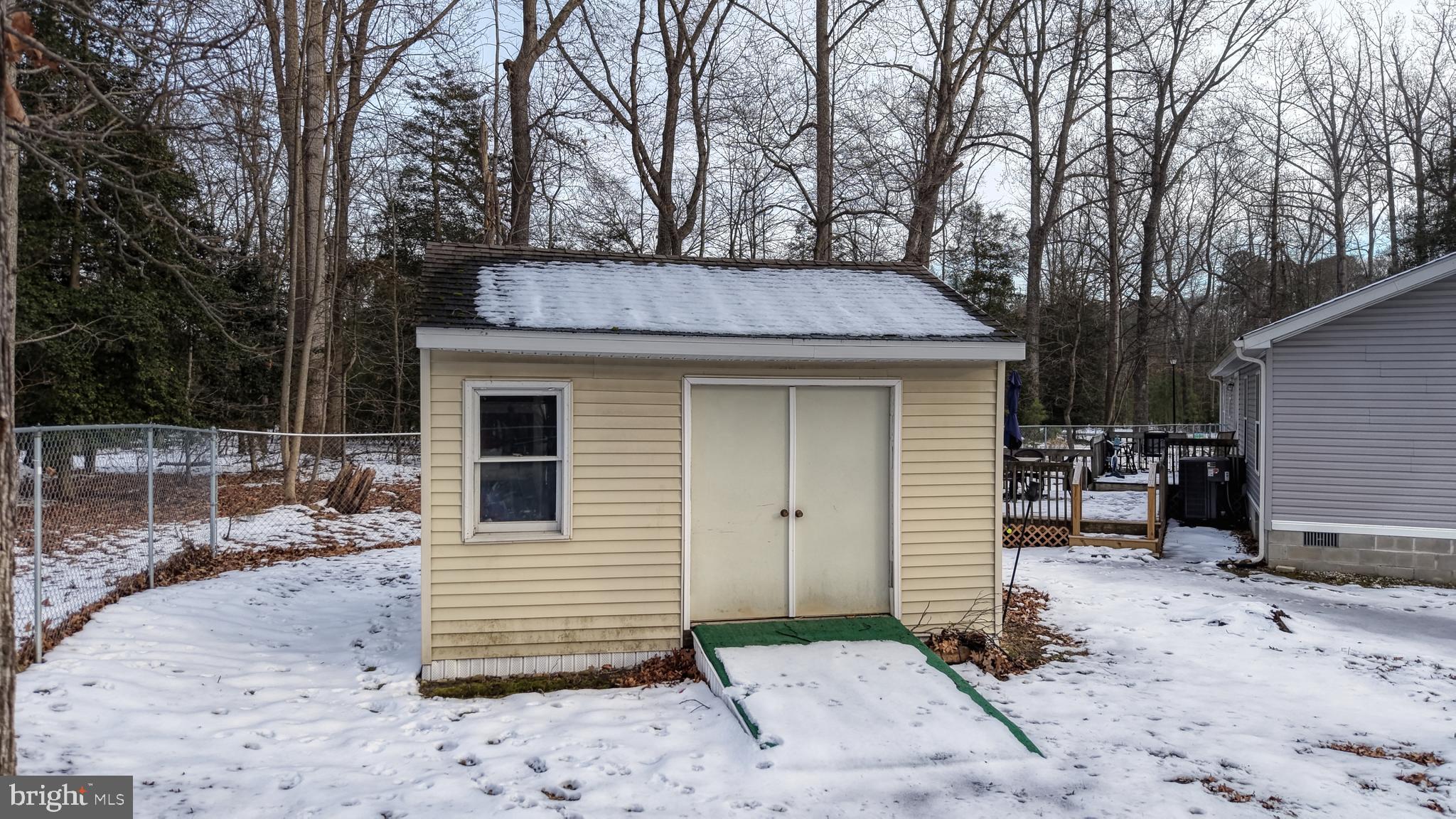 22901 Camp Arrowhead Road Lewes, DE 19958 - Photo 6 of 39 a view of a house with a yard