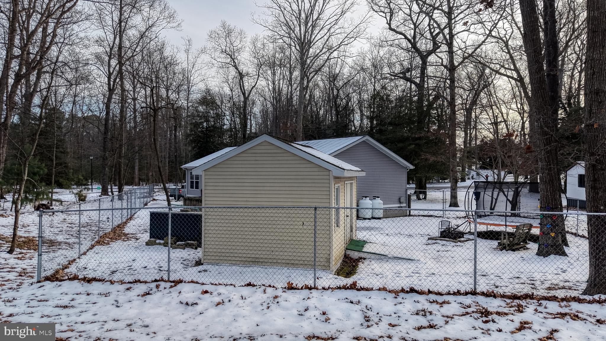 22901 Camp Arrowhead Road Lewes, DE 19958 - Photo 7 of 39 a view of a house with a yard and sitting area