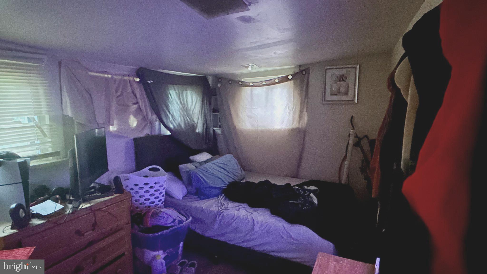 71 Poplar Street Penns Grove, NJ 08069 - Photo 5 of 10 a bedroom with a bed and a closet