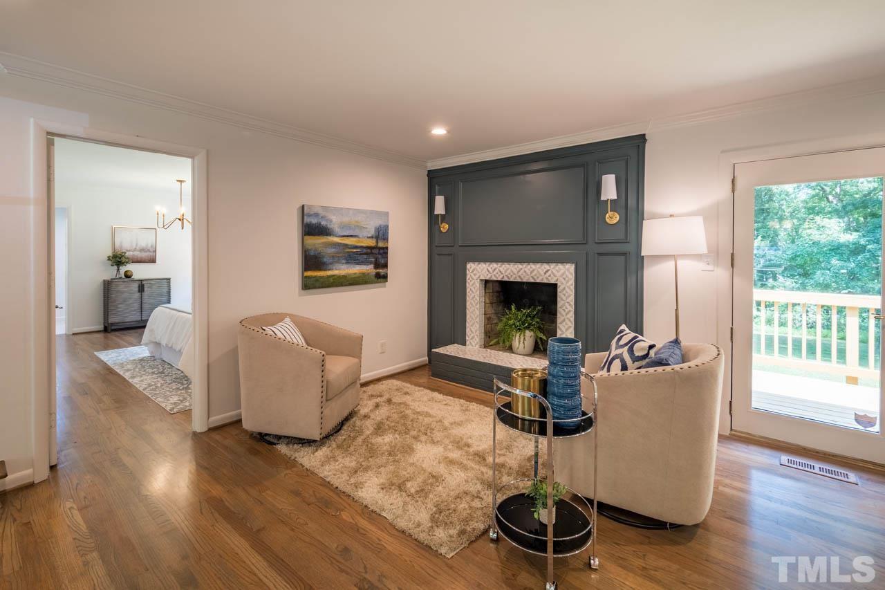 2823 Ridge Road Durham, NC 27705 - Photo 12 of 30 a living room with furniture a window and a fireplace