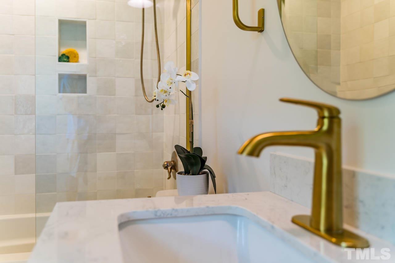 2823 Ridge Road Durham, NC 27705 - Photo 23 of 30 a bathroom with a sink and a mirror