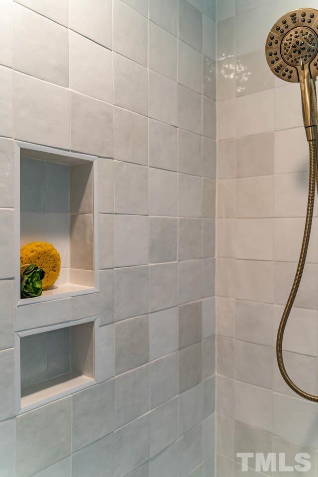 2823 Ridge Road Durham, NC 27705 - Photo 24 of 30 a bathroom with a sink and mirror