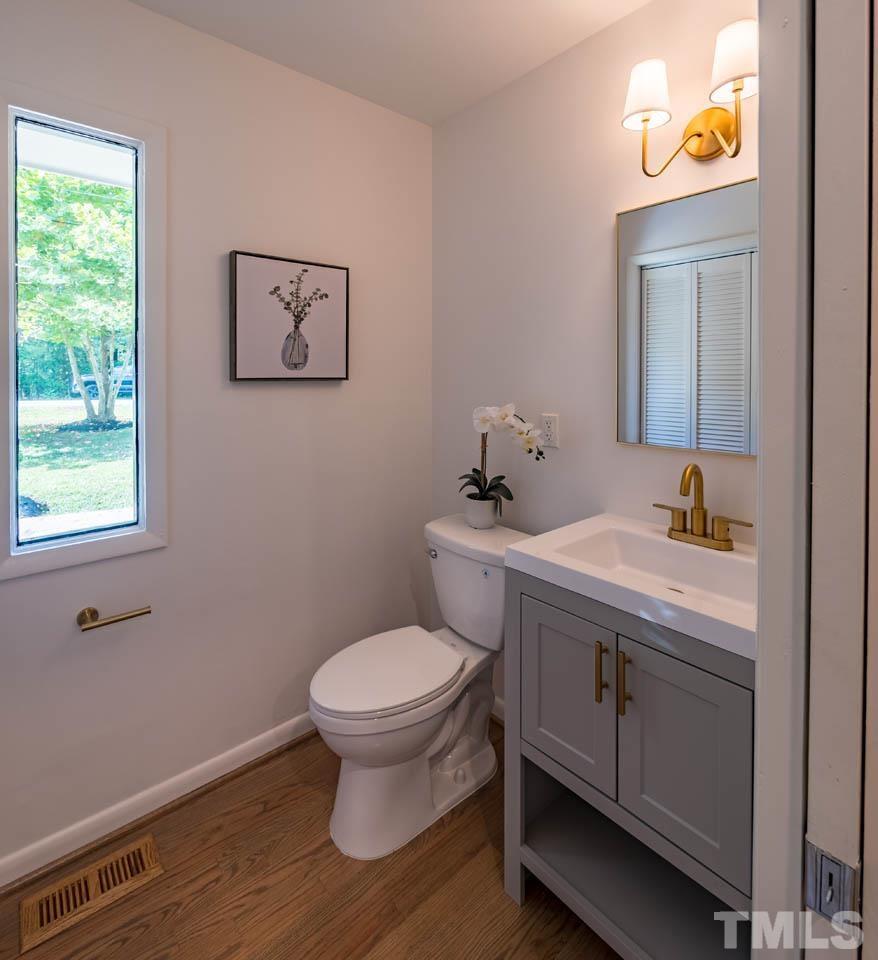 2823 Ridge Road Durham, NC 27705 - Photo 26 of 30 a bathroom with a sink and a toilet