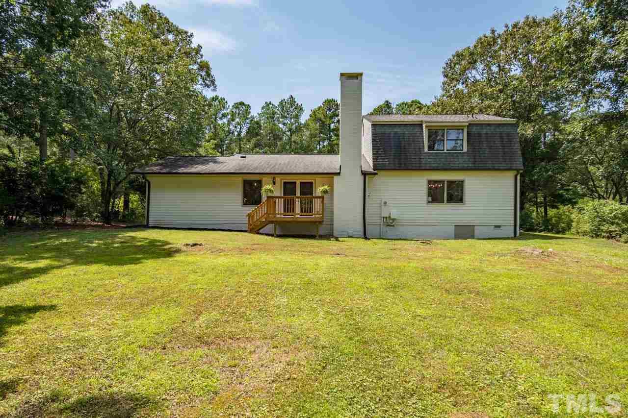 2823 Ridge Road Durham, NC 27705 - Photo 30 of 30 a front view of a house with a garden