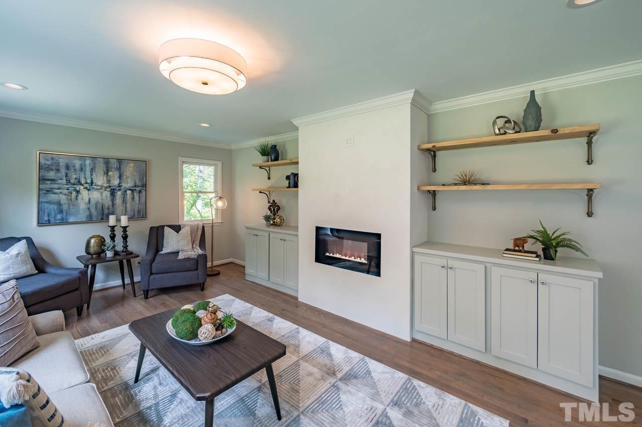 2823 Ridge Road Durham, NC 27705 - Photo 5 of 30 a living room with furniture and wooden floor