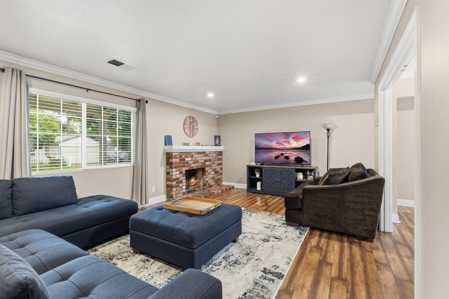 550 Bell Street Turlock, CA 95380 - Photo 9 of 36 a living room with furniture and a flat screen tv
