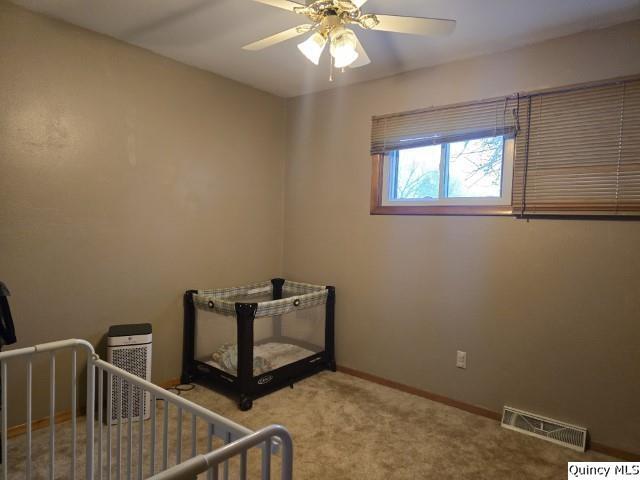710 Country Lane Carthage, IL 62321 - Photo 13 of 31 a view of an empty room with window and chandelier fan