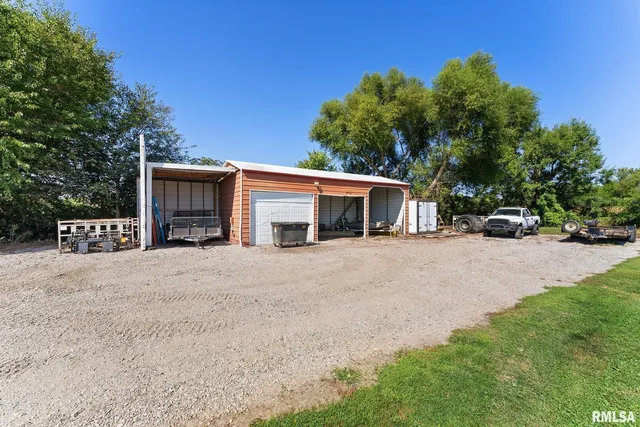 a view of house with outdoor space and car parked