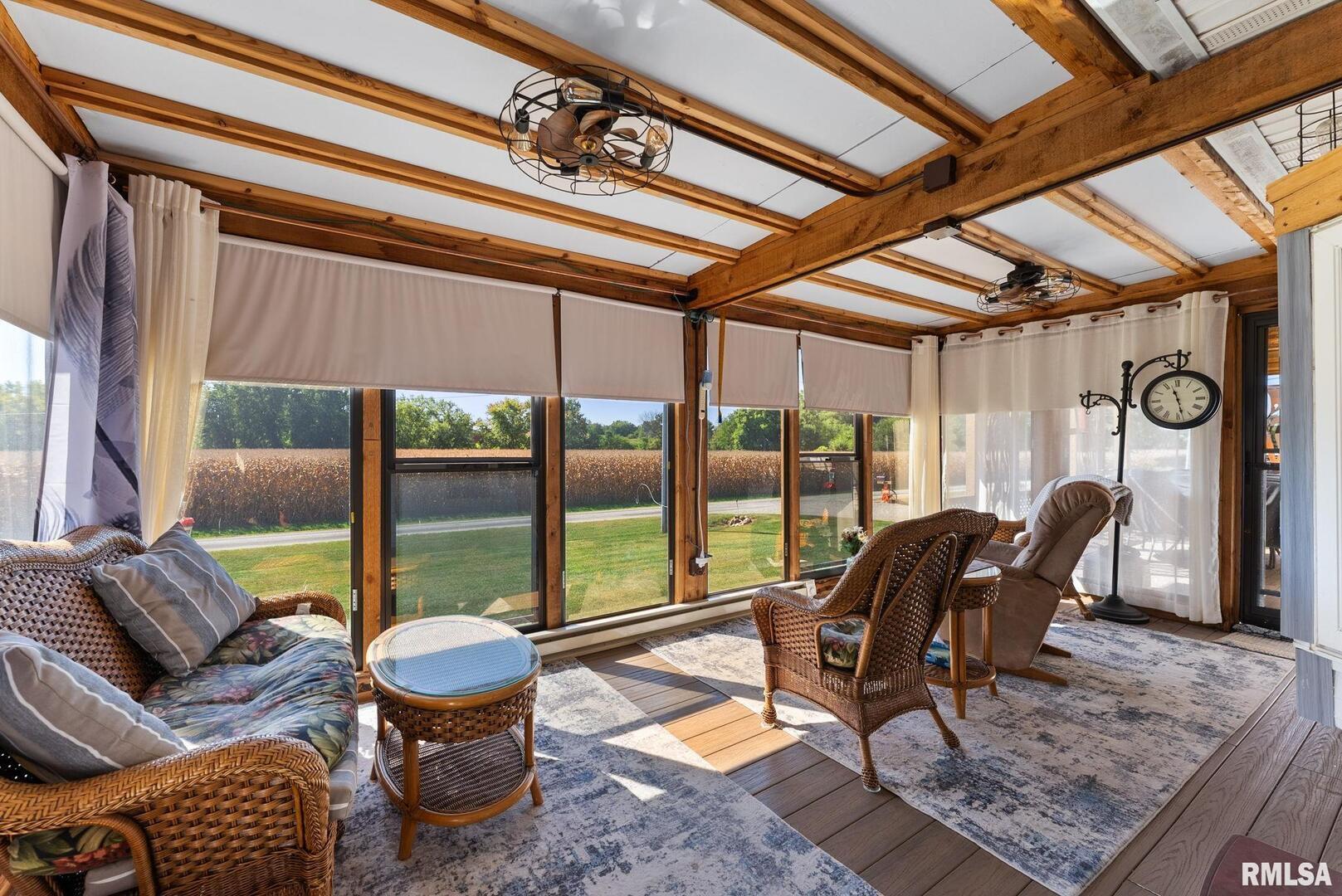 1422 McCloud Road Aledo, IL 61231 - Photo 15 of 44 a living room with furniture and a floor to ceiling window