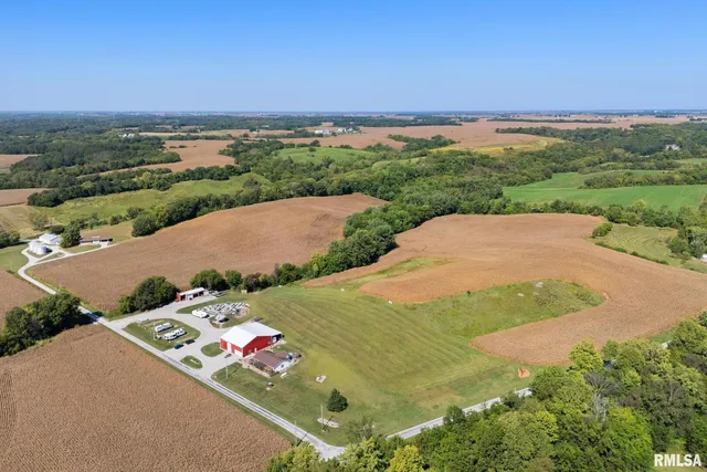an aerial view of a house with garden space and street view