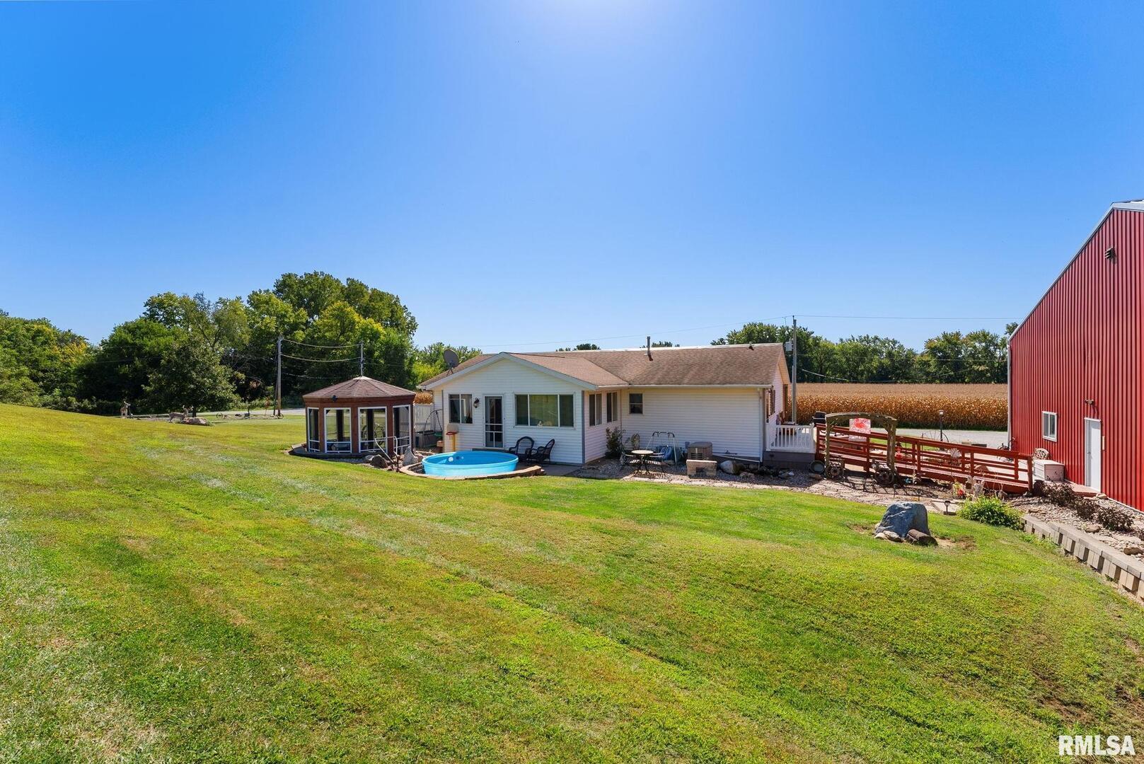 1422 McCloud Road Aledo, IL 61231 - Photo 5 of 44 a house view with a sitting space and garden