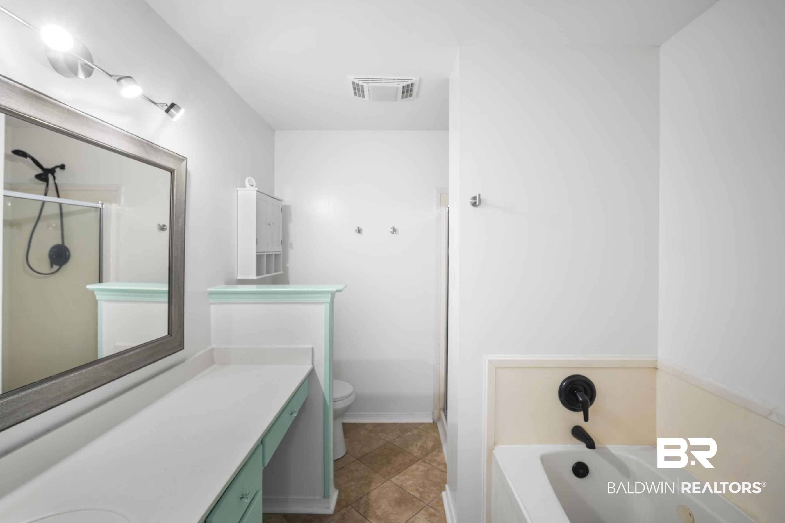 3101 Autumn Ridge Drive West Mobile, AL 36695 - Photo 17 of 36 Full bathroom with a bath, vanity, and a stall shower
