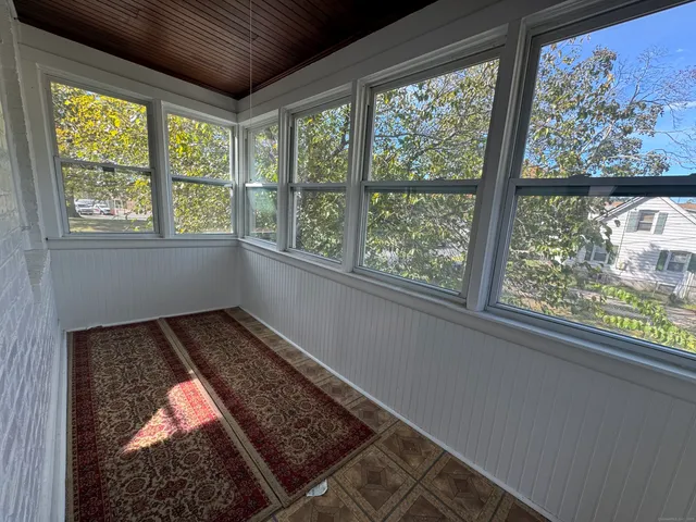 a view of a room that has a bed