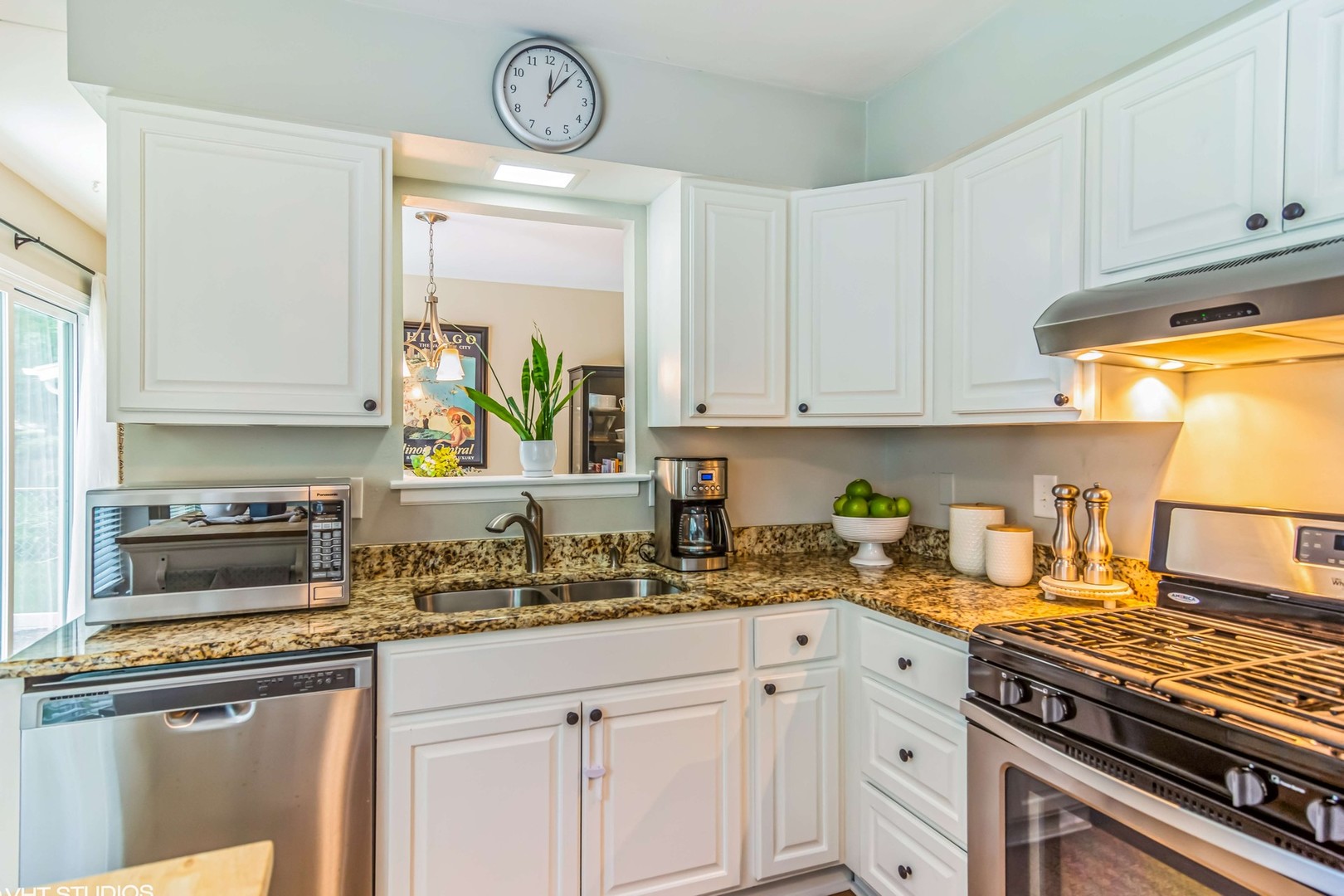 1097 Greenridge Road Buffalo Grove, IL 60089 - Photo 4 of 27 a kitchen with stainless steel appliances granite countertop a sink a stove and cabinets