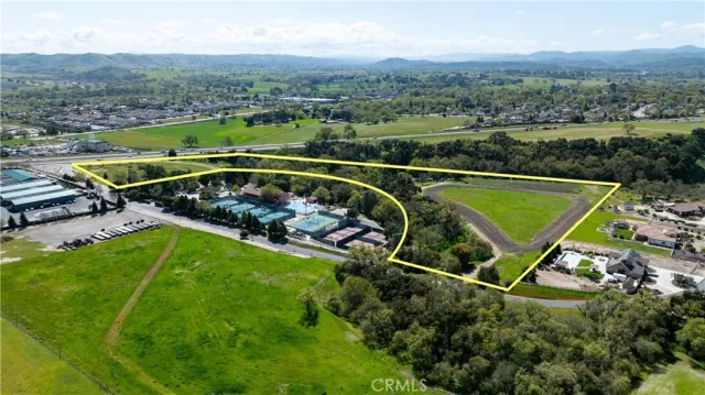 an aerial view of a house with a garden