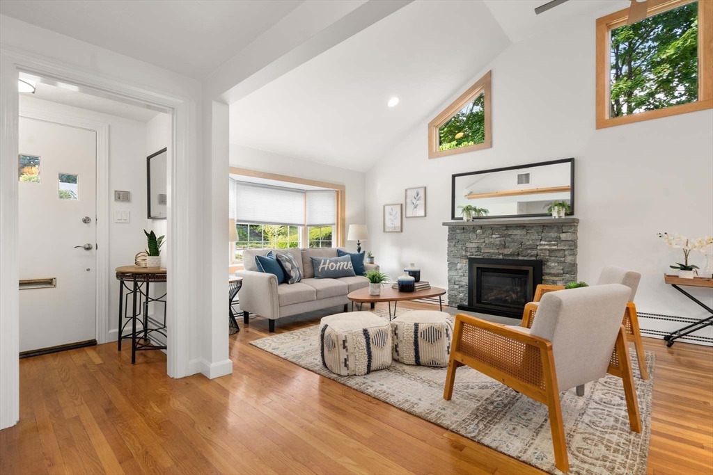 226 Grove Street Brookline, MA 02467 - Photo 1 of 23 a living room with furniture and a fireplace
