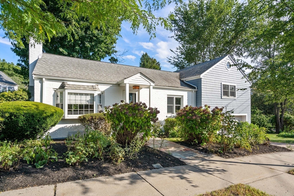 226 Grove Street Brookline, MA 02467 - Photo 19 of 23 a front view of a house with garden