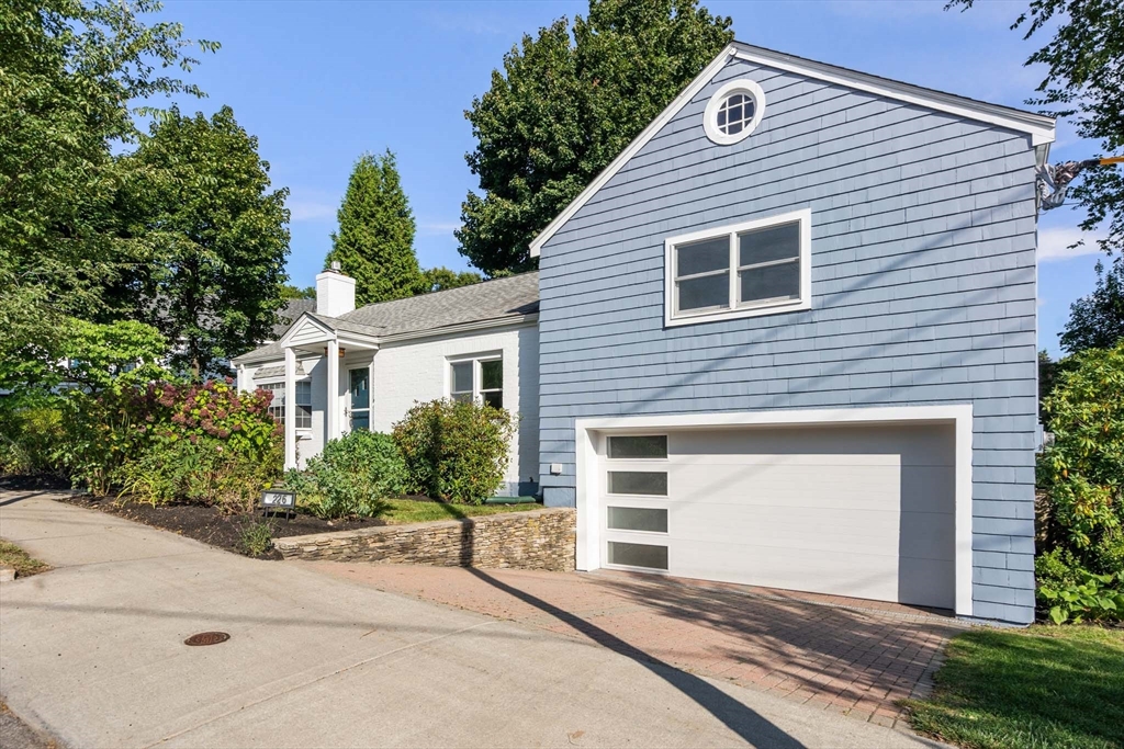 226 Grove Street Brookline, MA 02467 - Photo 23 of 23 a front view of a house with a yard and garage