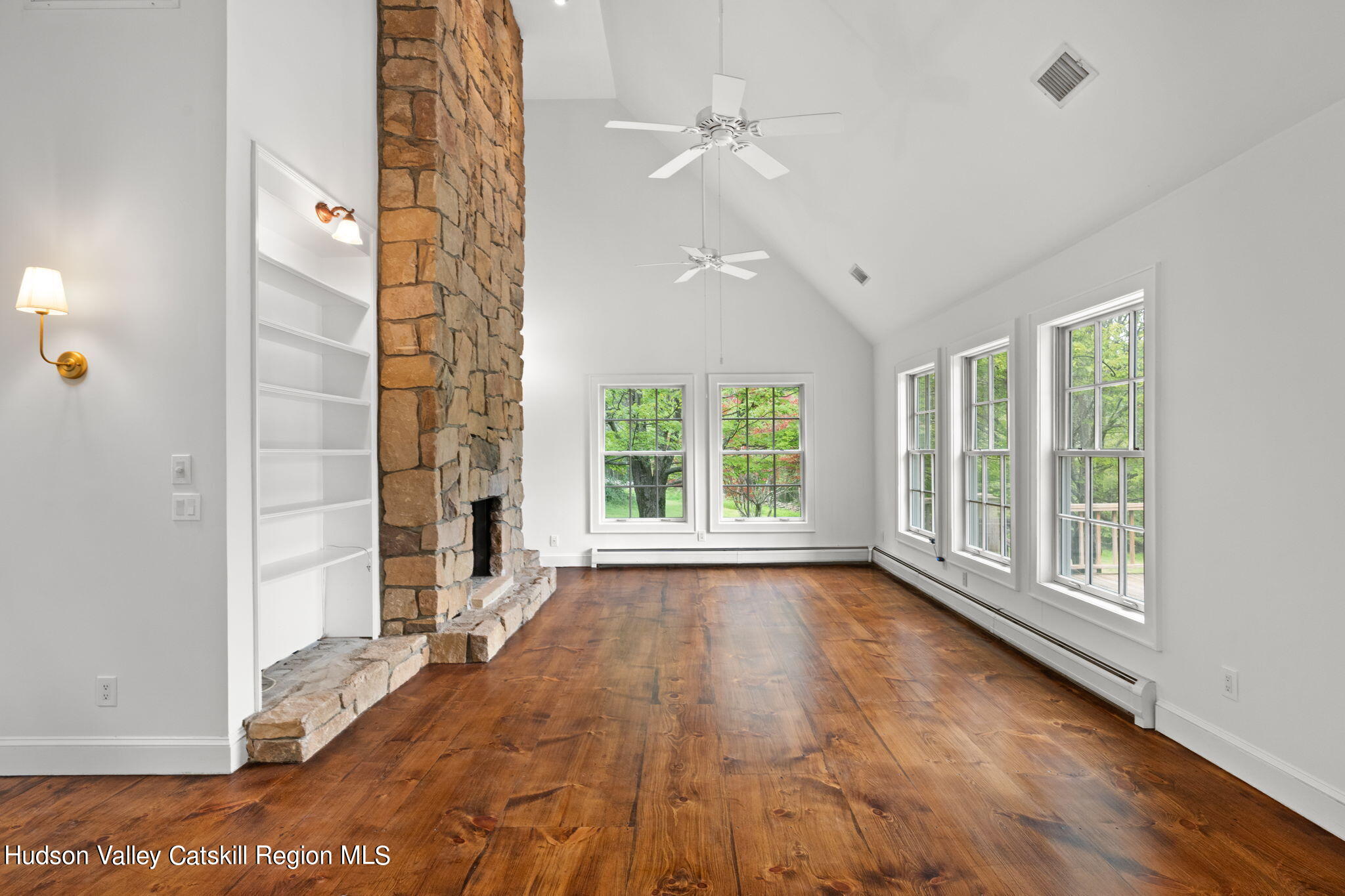 90 Highland Road Stone Ridge, NY 12484 - Photo 6 of 27 a view of an empty room with a window and wooden floor