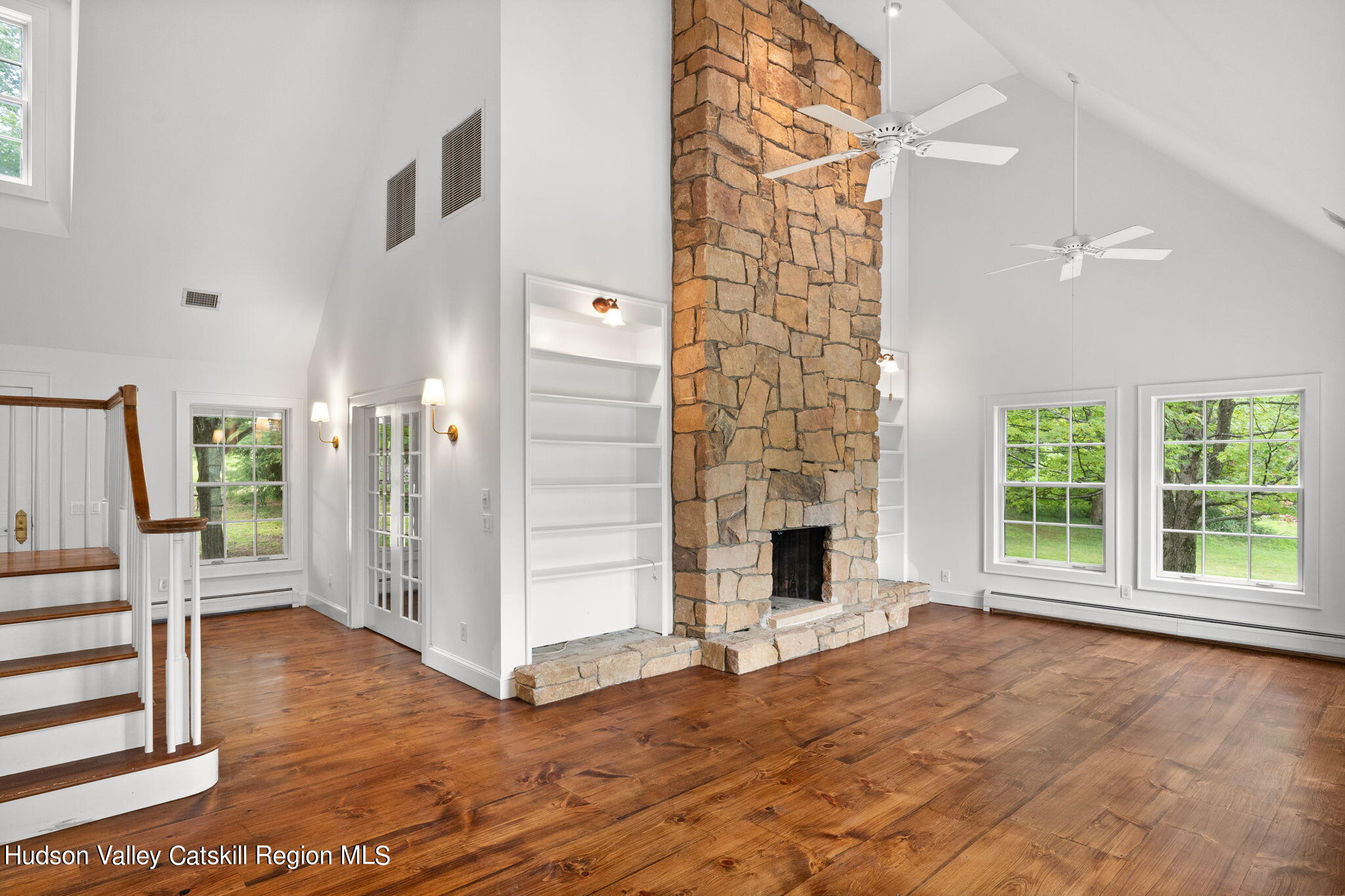 90 Highland Road Stone Ridge, NY 12484 - Photo 7 of 27 a view of an empty room with wooden floor and a fireplace