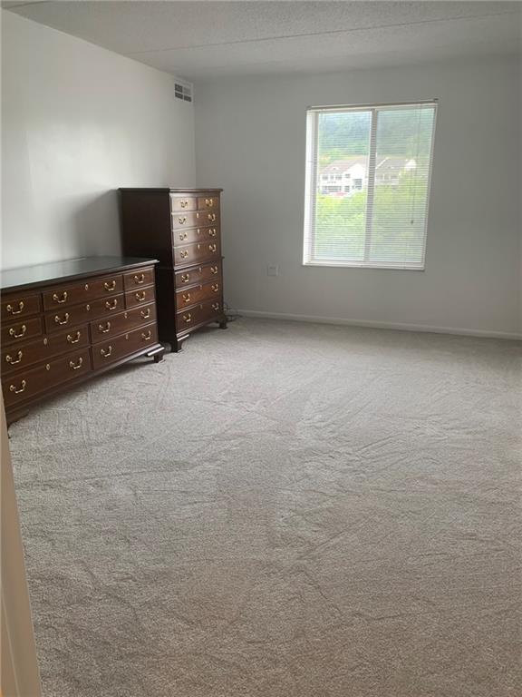 2120 Greentree Road, Unit TE11 Pittsburgh, PA 15220 - Photo 13 of 23 a view of an empty room with a window and a kitchen