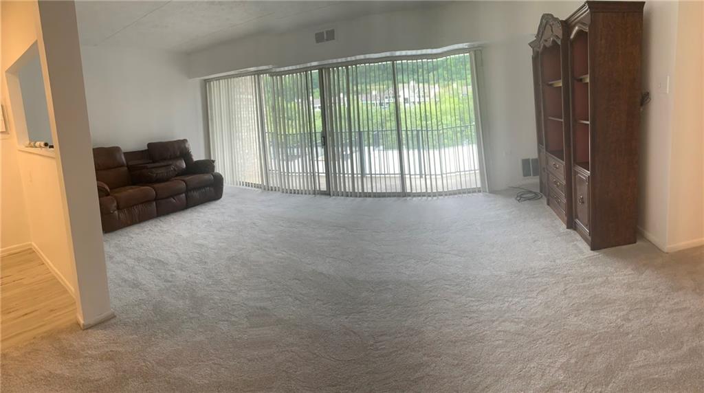 2120 Greentree Road, Unit TE11 Pittsburgh, PA 15220 - Photo 8 of 23 a living room with furniture and a floor to ceiling window