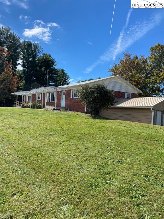 4749 Shawtown Road Ennice, NC 28623 - Photo 1 of 1 a view of a house with a yard