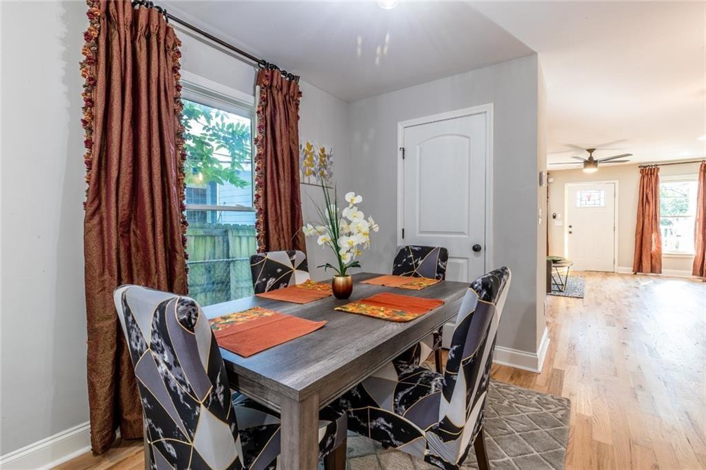 955 Coleman Street Southwest Atlanta, GA 30310 - Photo 19 of 56 a view of a dining room with furniture and wooden floor