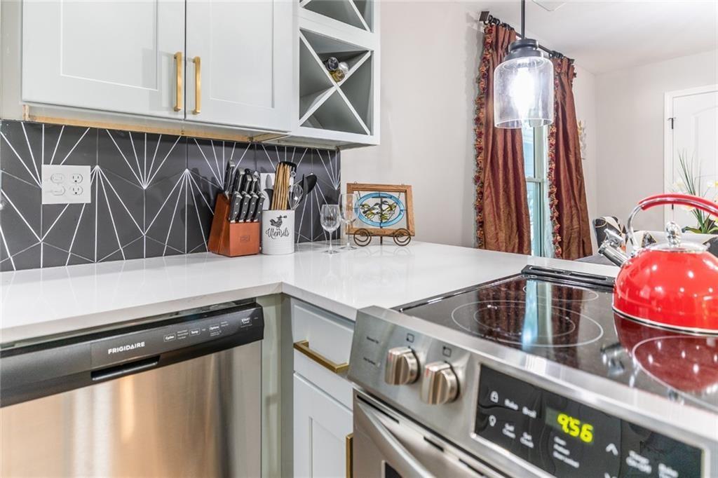 955 Coleman Street Southwest Atlanta, GA 30310 - Photo 26 of 56 a kitchen with a stove and a sink