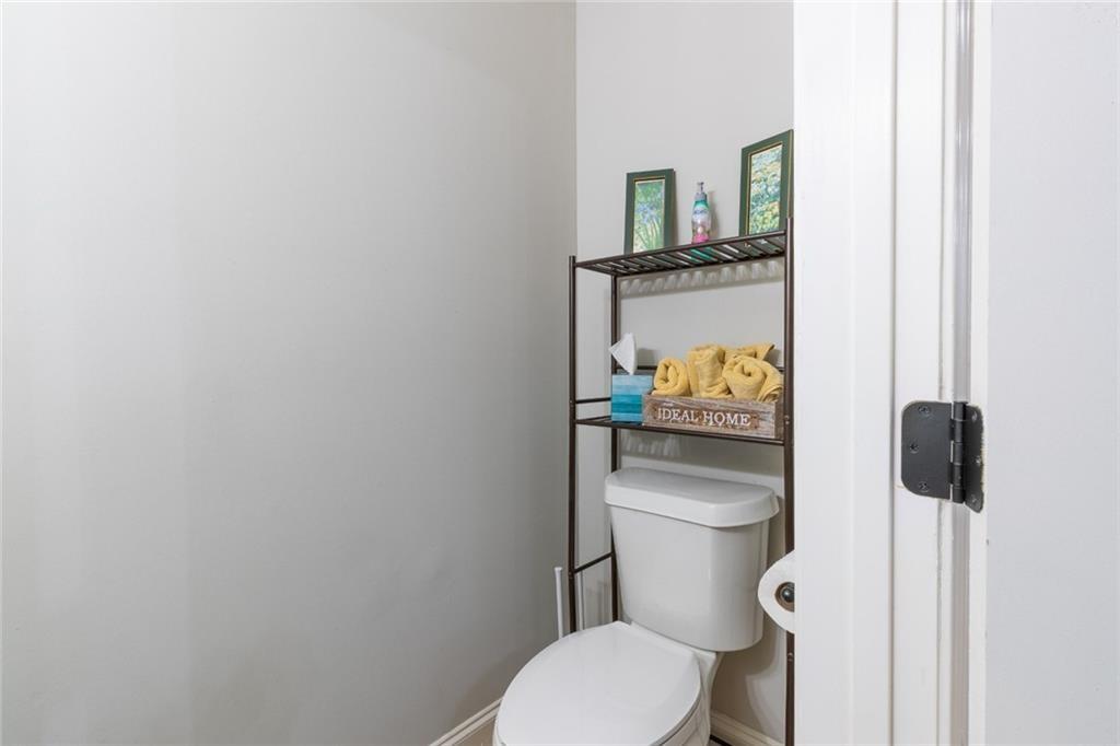 955 Coleman Street Southwest Atlanta, GA 30310 - Photo 35 of 56 a white toilet sitting next to a bathroom sink