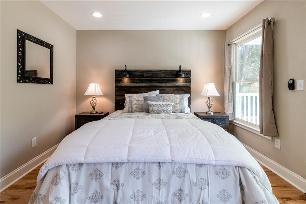 955 Coleman Street Southwest Atlanta, GA 30310 - Photo 37 of 56 a bedroom with a bed and wooden floor