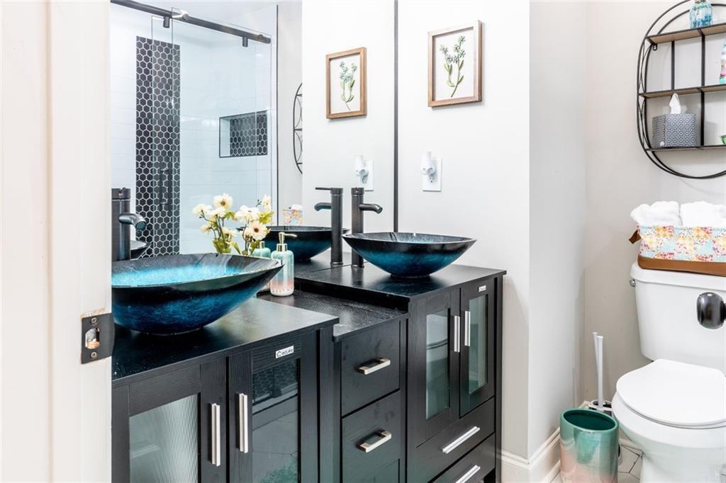 955 Coleman Street Southwest Atlanta, GA 30310 - Photo 40 of 56 a bathroom with a sink and a toilet