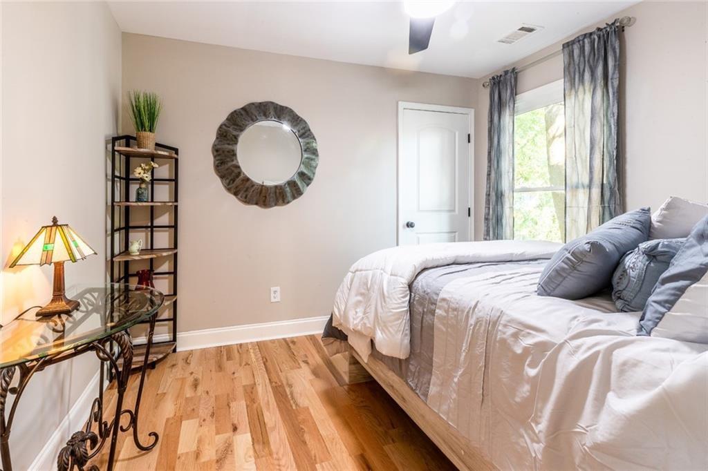 955 Coleman Street Southwest Atlanta, GA 30310 - Photo 44 of 56 a bedroom with a bed and a chandelier