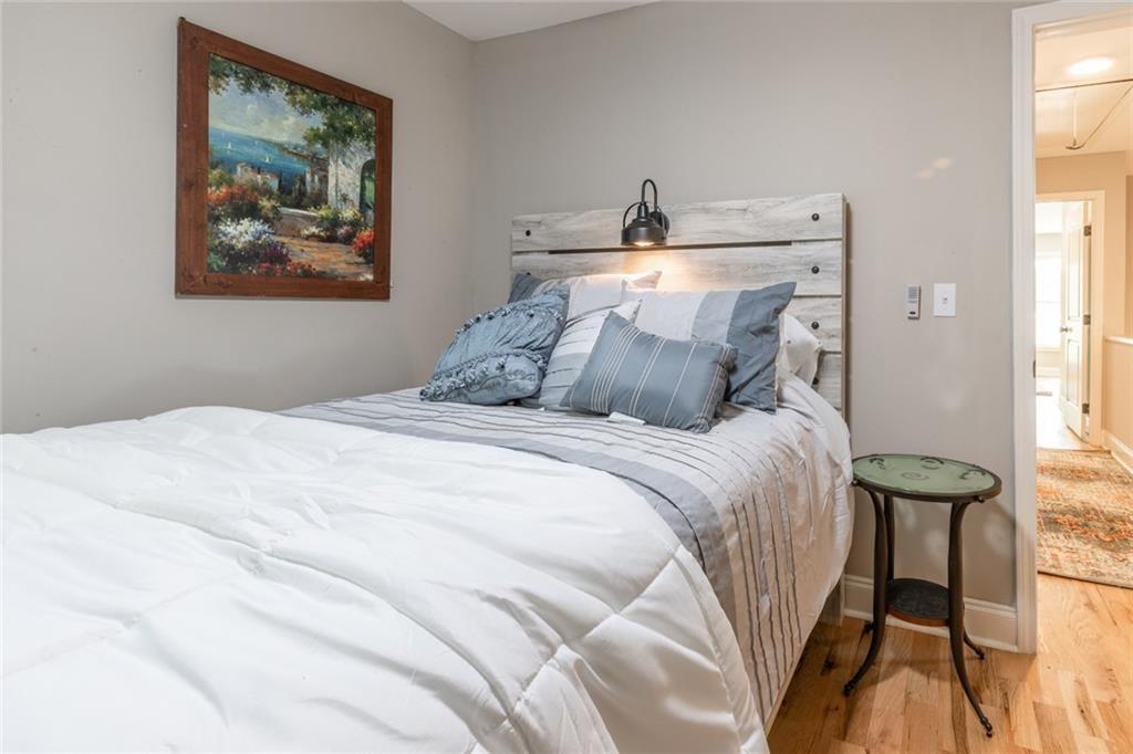 955 Coleman Street Southwest Atlanta, GA 30310 - Photo 45 of 56 a bedroom with a bed and a painting on the wall