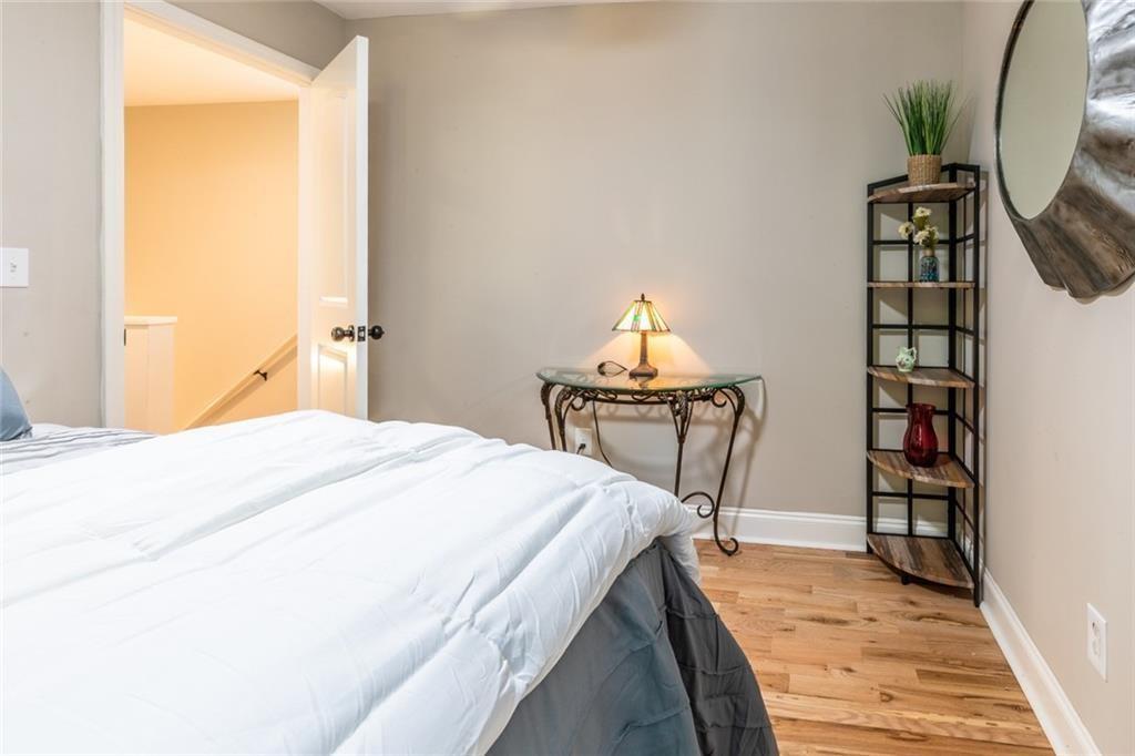 955 Coleman Street Southwest Atlanta, GA 30310 - Photo 46 of 56 a bedroom with a bed and a book shelf